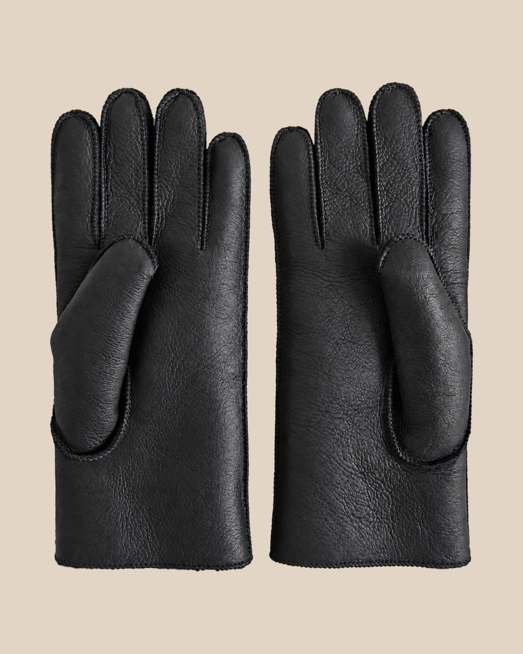 Nappa shearling gloves - black — product view 01, shearling gloves on a beige background