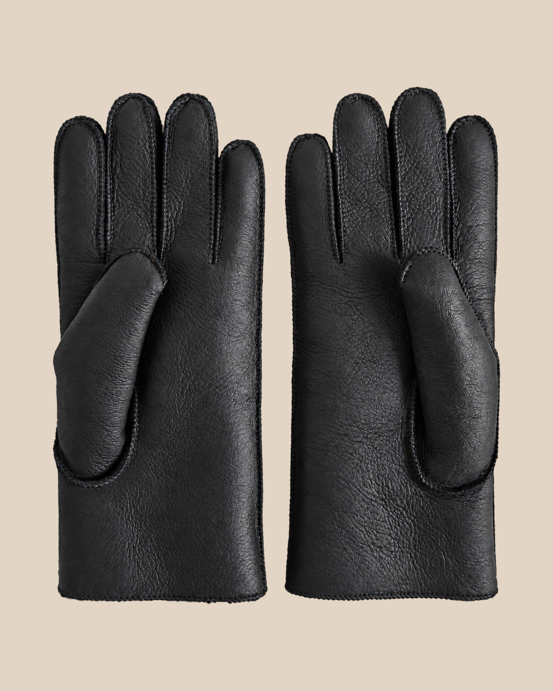 Nappa shearling gloves - black — product view 01, shearling gloves on a beige background