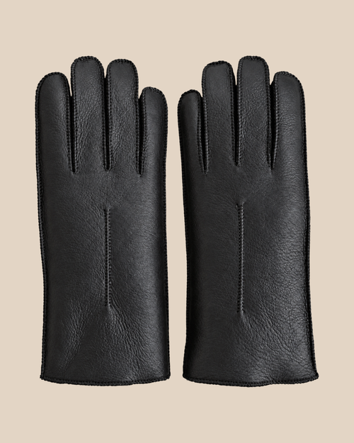 Nappa shearling gloves - black — product view 02, shearling gloves on a beige background