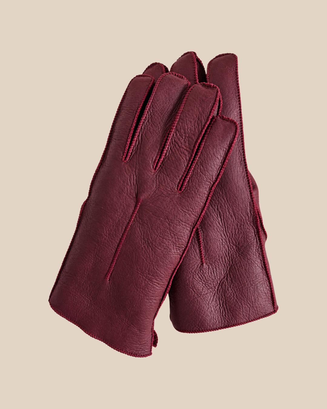 Nappa shearling gloves - burgundy — product view 01, shearling gloves on a beige background