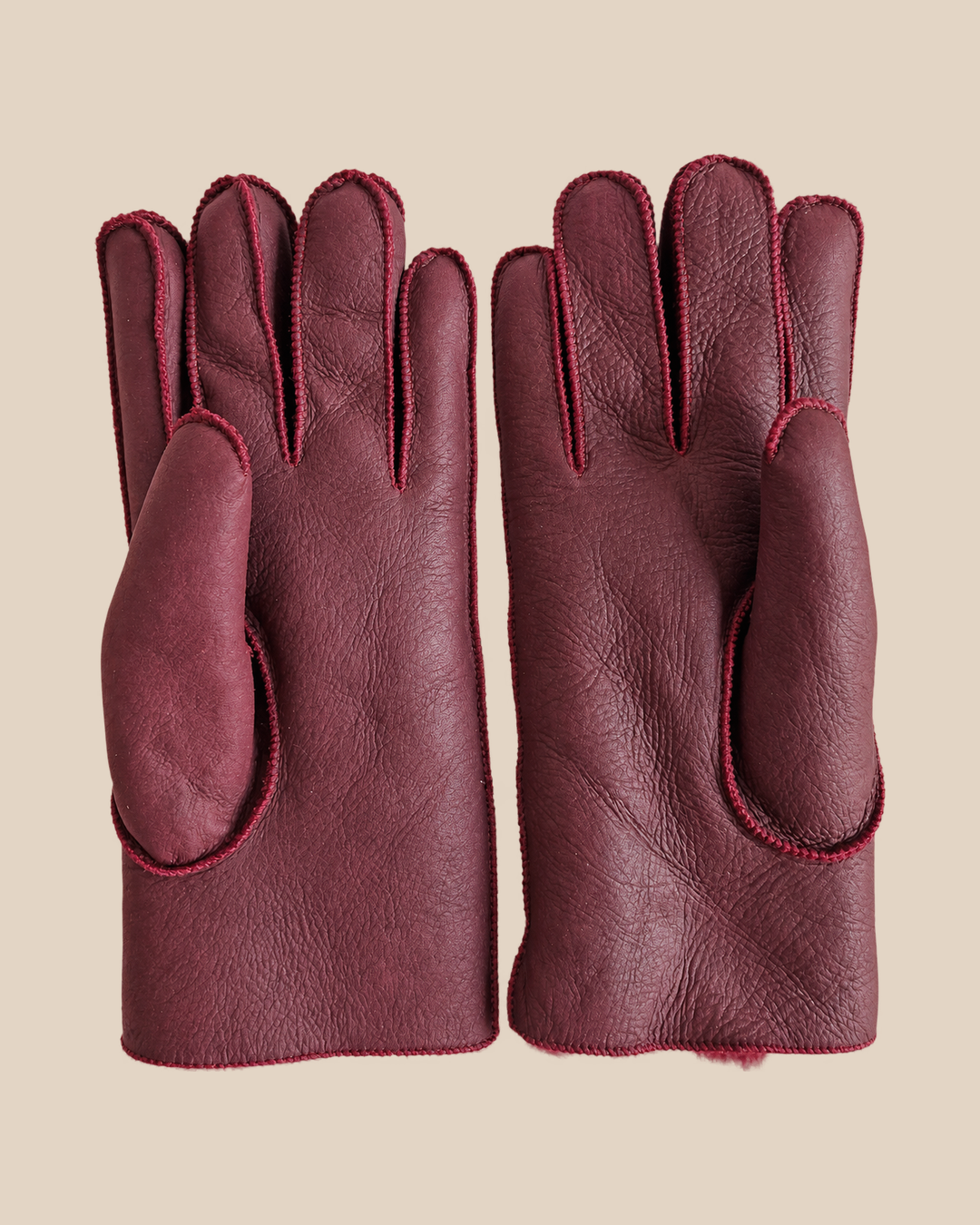 Nappa shearling gloves - burgundy — product view 02, shearling gloves on a beige background