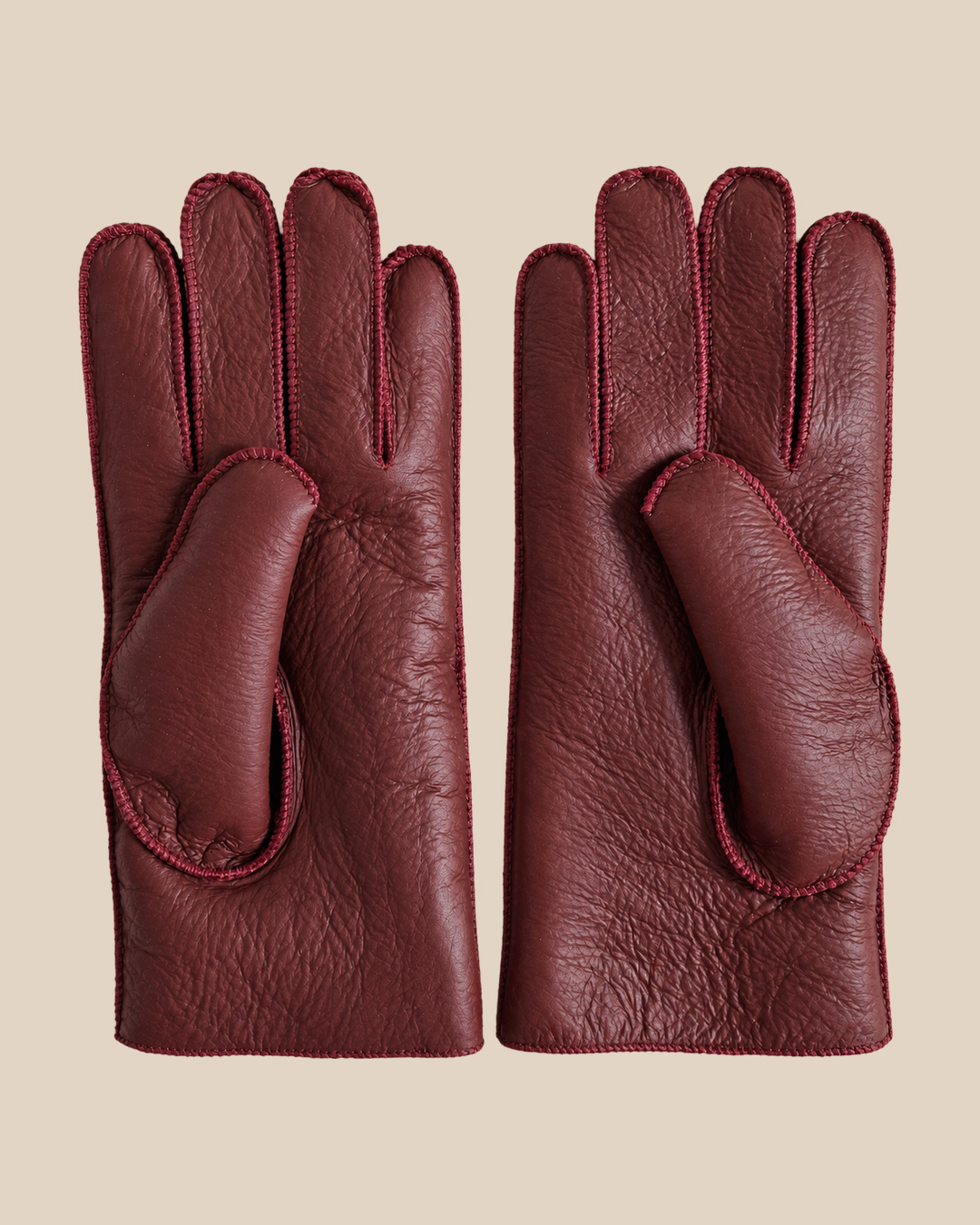 Nappa shearling gloves - burgundy — product view 05, shearling gloves on a beige background