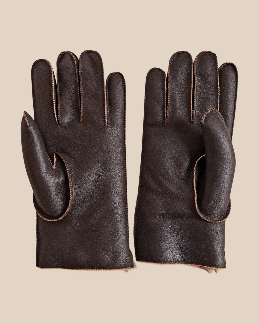 Nappa shearling gloves - dark brown — product view 01, shearling gloves on a beige background