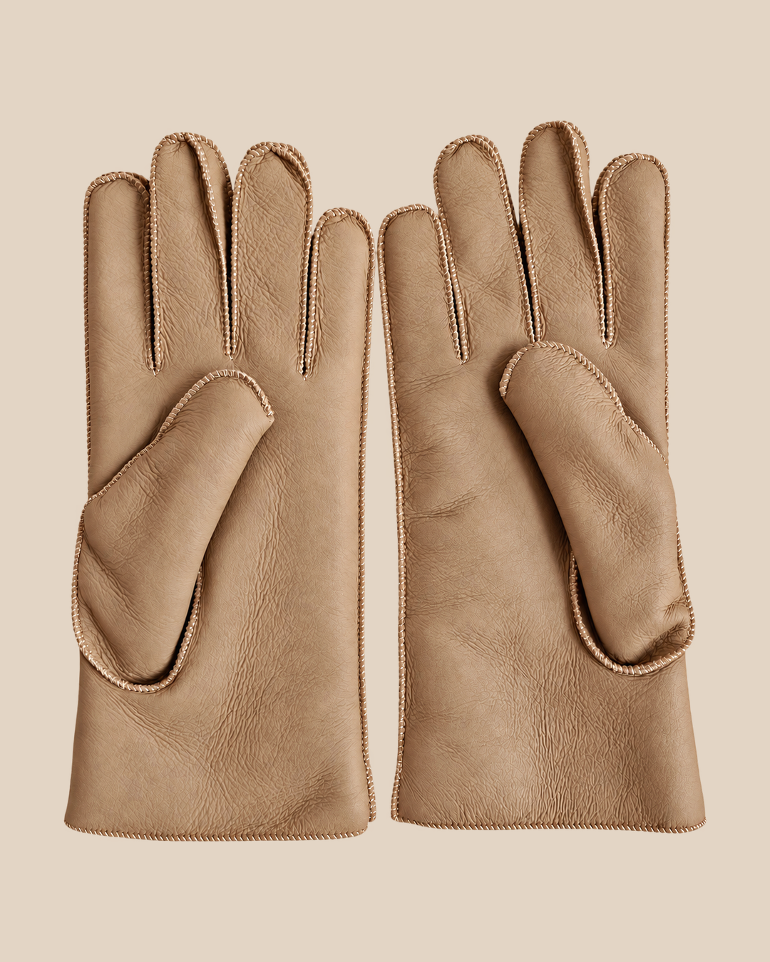 Nappa shearling gloves - taupe — product view 01, shearling gloves on a beige background