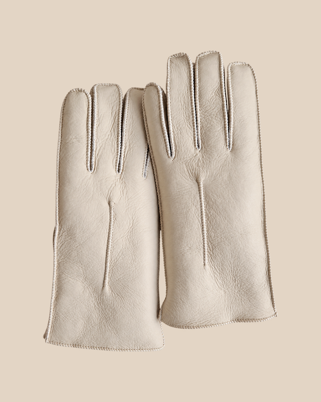 Nappa shearling gloves - white — product view 02, shearling gloves on a beige background