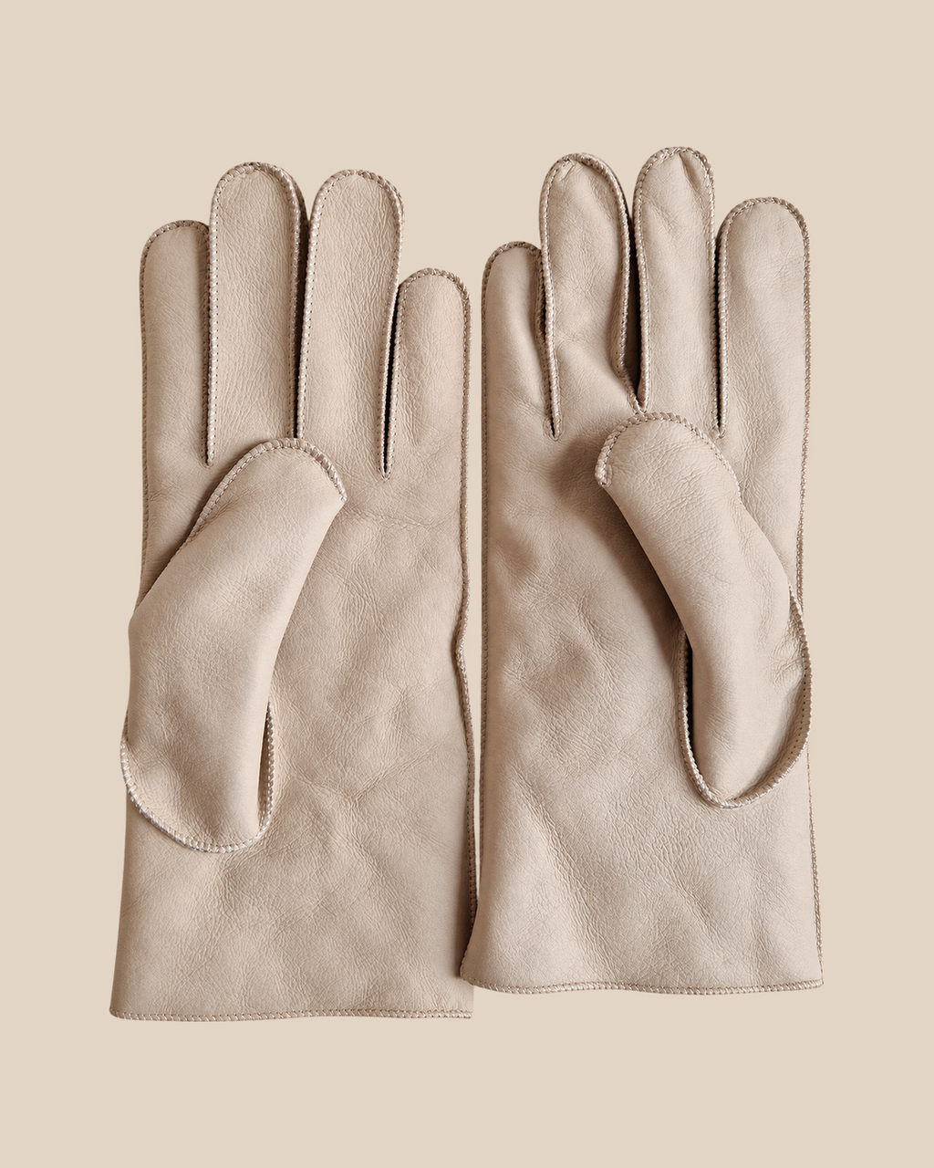 Nappa shearling gloves - white — product view 03, shearling gloves on a beige background