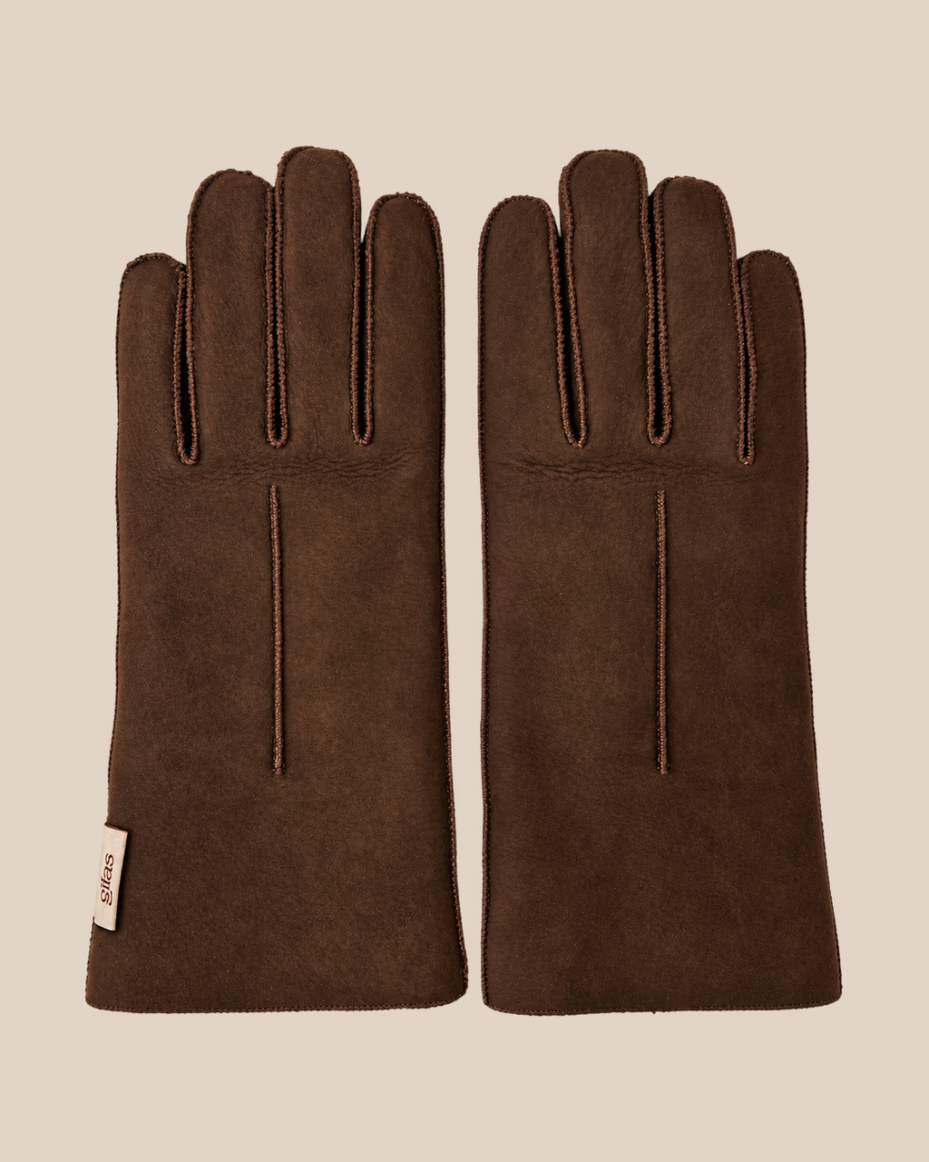 Suede shearling gloves - dark brown gilas — product view 01, shearling gloves on a beige background