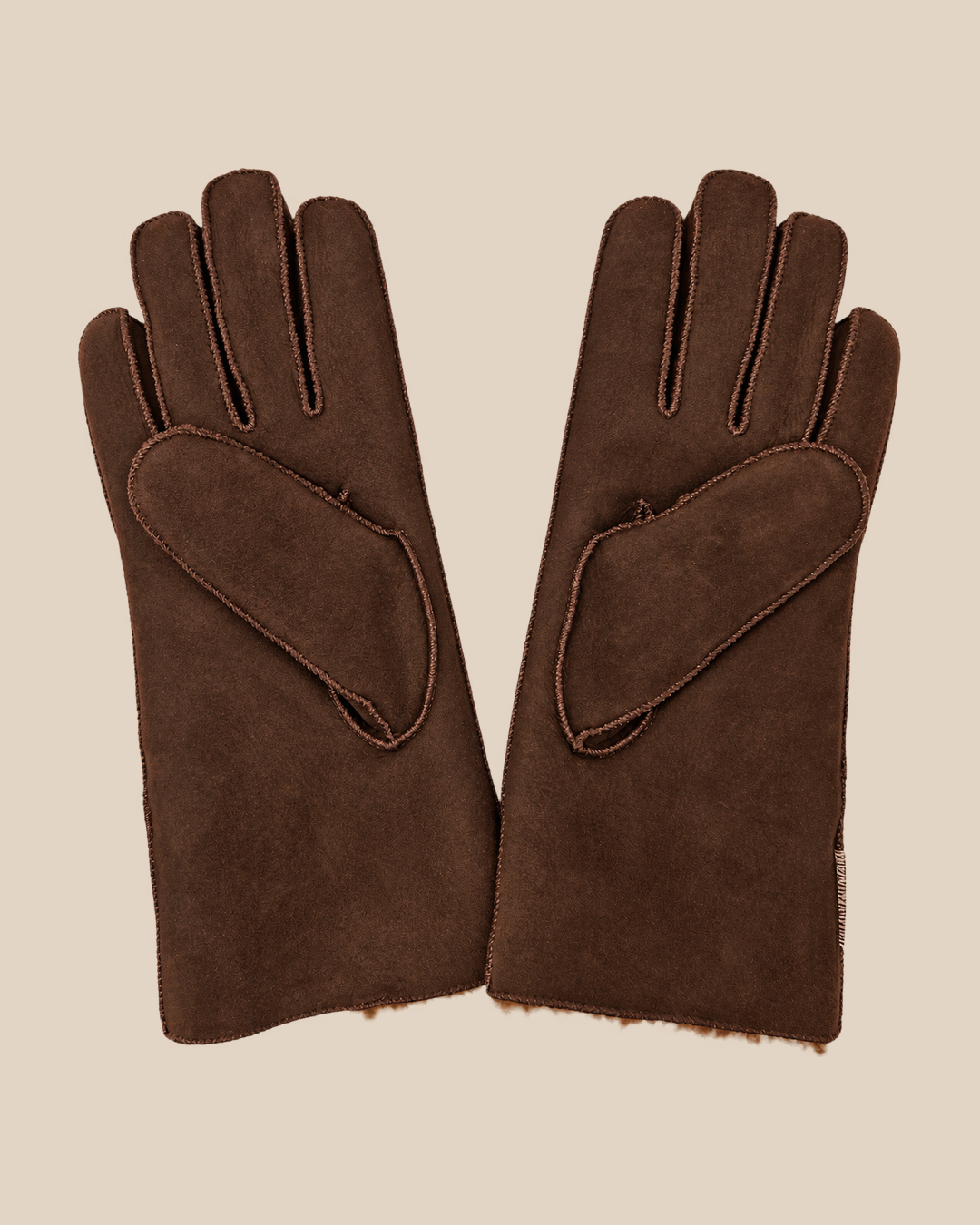 Suede shearling gloves - dark brown gilas — product view 02, shearling gloves on a beige background