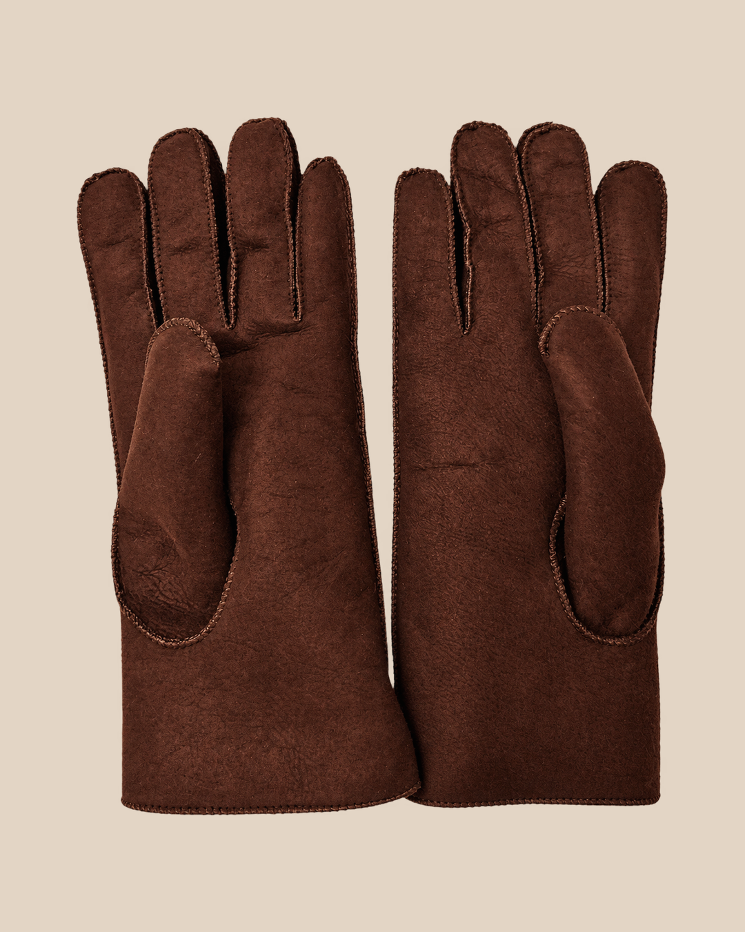 Suede shearling gloves - dark-brown, palm view on a beige background