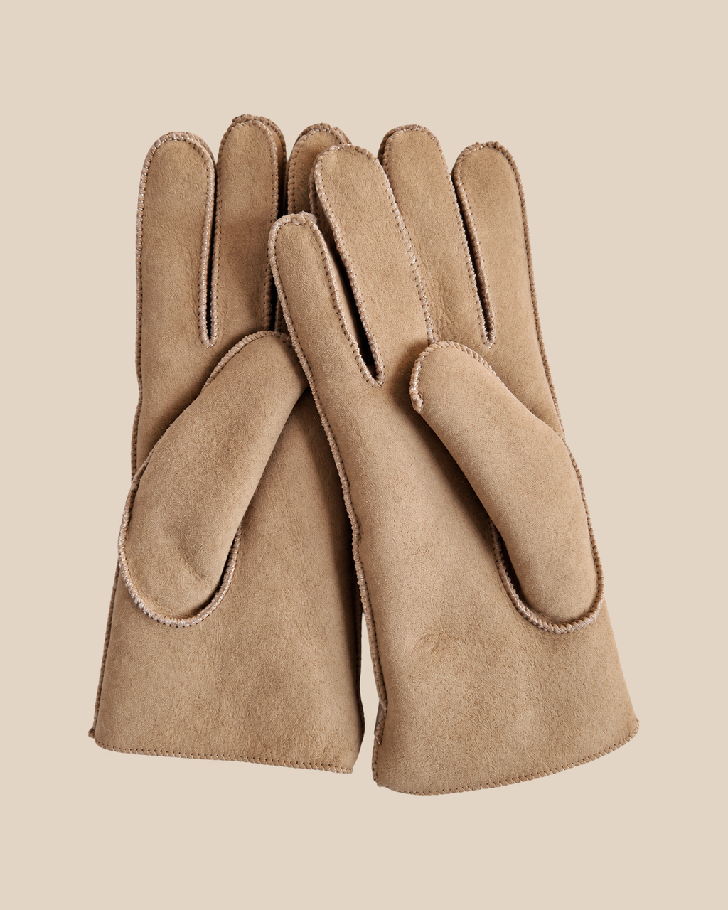 Suede shearling gloves - nude — product view 01, shearling gloves on a beige background
