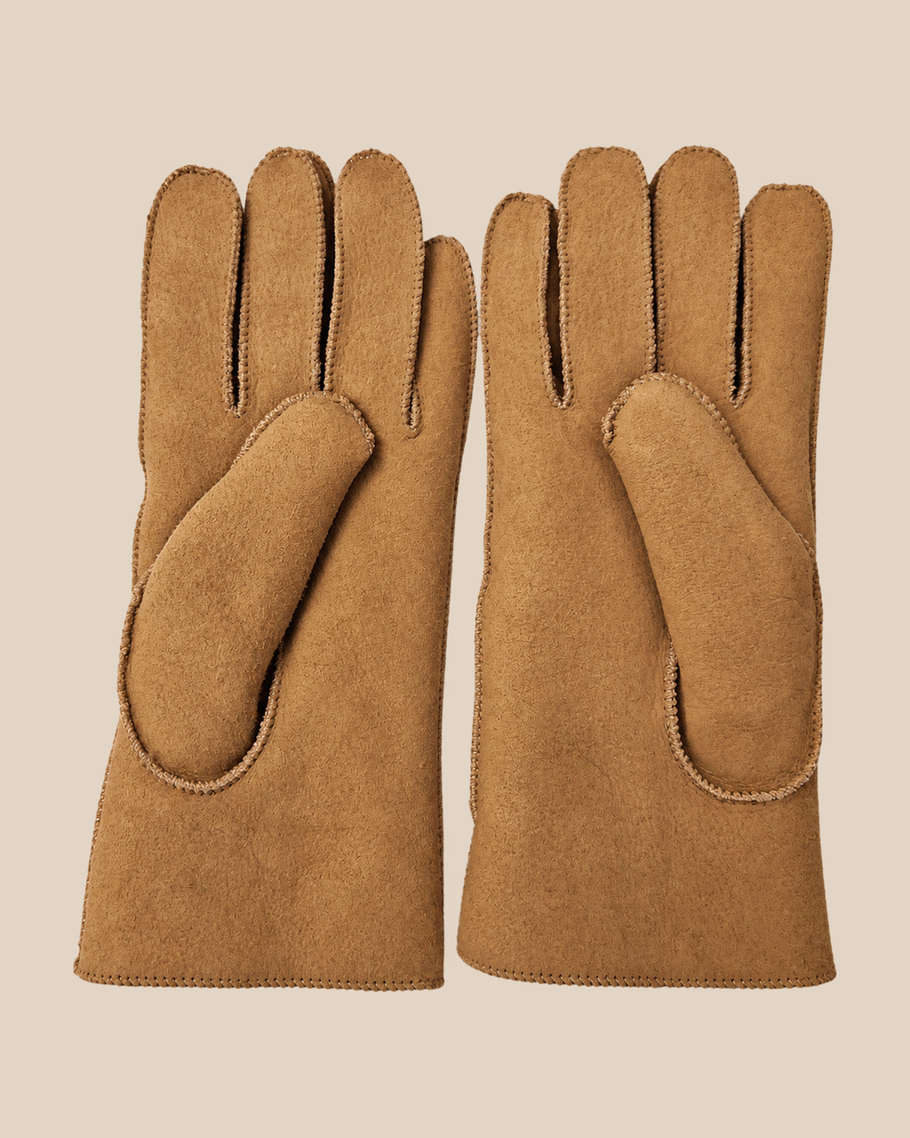 Suede shearling gloves - nude, palm view on a beige background