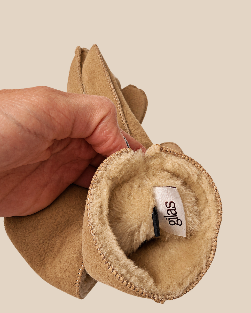 Suede shearling gloves - nude, shearling lining detail on a beige background