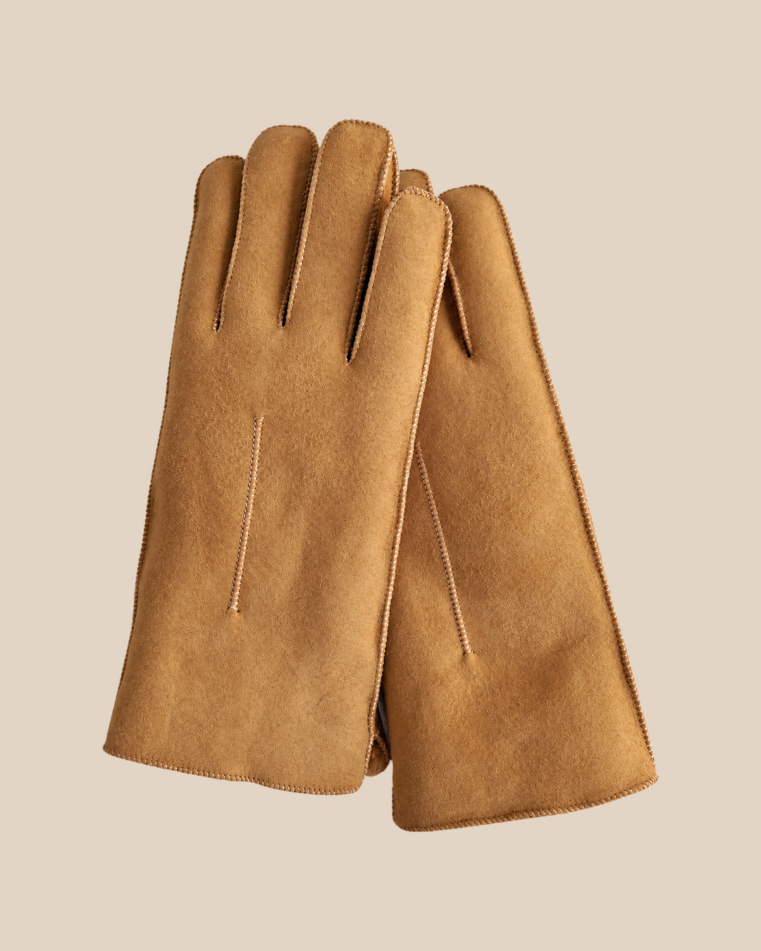 Suede shearling gloves - whiskey — product view 01, shearling gloves on a beige background