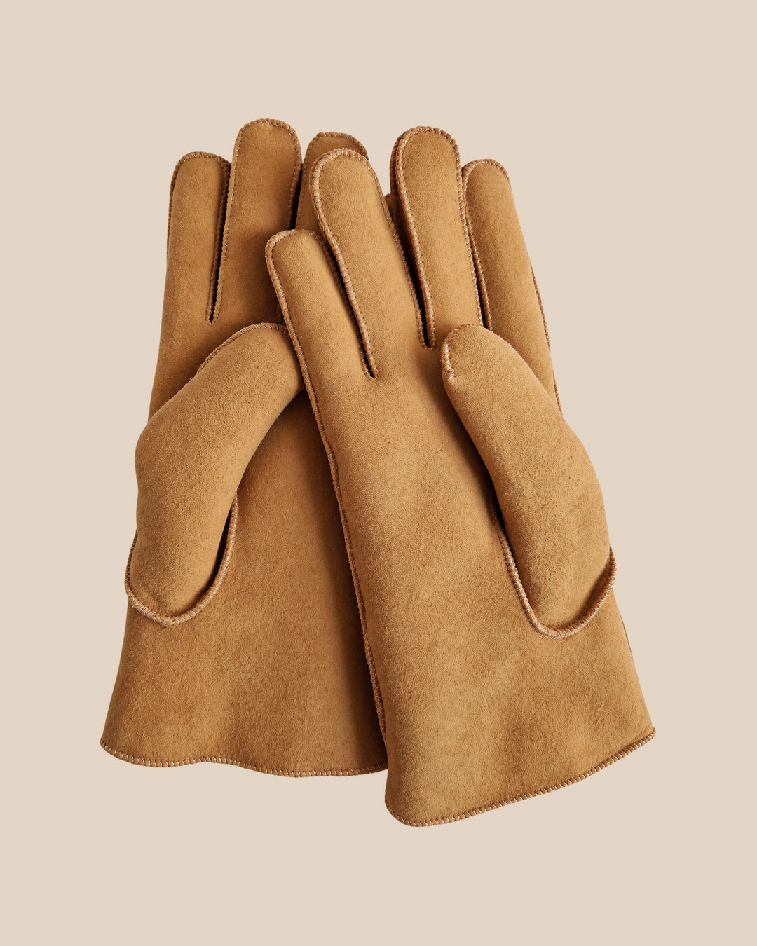 Suede shearling gloves - whiskey — product view 02, shearling gloves on a beige background